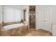 Bright bathroom featuring a soaking tub, walk-in shower, double vanity, and neutral tiling at 4101 Rickenbacker Ne Dr, Atlanta, GA 30342