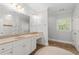 Well-lit bathroom featuring a double sink vanity, a neutral color palette, and a separate shower and toilet area at 4101 Rickenbacker Ne Dr, Atlanta, GA 30342