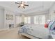 Bright bedroom boasts a tray ceiling, plush carpeting, comfortable bed and plenty of sunlight at 4101 Rickenbacker Ne Dr, Atlanta, GA 30342