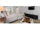 Bedroom with natural light, accent rug, and media console at 4101 Rickenbacker Ne Dr, Atlanta, GA 30342