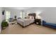 Bedroom with natural light, seating area, and bedside tables at 4101 Rickenbacker Ne Dr, Atlanta, GA 30342