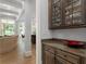 View of a butler's pantry with granite counters and custom wood cabinets at 4101 Rickenbacker Ne Dr, Atlanta, GA 30342
