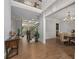 Bright foyer leading to a dining room and a staircase with decorative features and hardwood floors at 4101 Rickenbacker Ne Dr, Atlanta, GA 30342