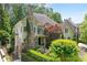 Charming two-story home with a stone chimney and a beautifully landscaped front yard at 4101 Rickenbacker Ne Dr, Atlanta, GA 30342