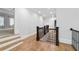 Hallway with hardwood floors, staircase, and entryways to other rooms at 4101 Rickenbacker Ne Dr, Atlanta, GA 30342