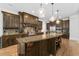 Gourmet kitchen featuring a large island, custom cabinetry, and stainless steel appliances at 4101 Rickenbacker Ne Dr, Atlanta, GA 30342