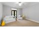 Cozy living room with neutral tones, balcony access, and ample natural light at 4101 Rickenbacker Ne Dr, Atlanta, GA 30342