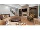 The living room features a stone fireplace, a coffered ceiling, and great natural light at 4101 Rickenbacker Ne Dr, Atlanta, GA 30342