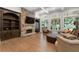 Open concept living room features a stone fireplace and custom built-ins at 4101 Rickenbacker Ne Dr, Atlanta, GA 30342