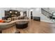Living room featuring stairs, hardwood floors and an open floor plan at 4101 Rickenbacker Ne Dr, Atlanta, GA 30342