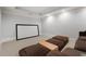Home theater room with a large screen, tray ceiling, and comfy seating at 4101 Rickenbacker Ne Dr, Atlanta, GA 30342