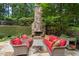 Outdoor patio with fireplace and comfortable seating at 4101 Rickenbacker Ne Dr, Atlanta, GA 30342