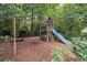 Backyard includes a swing set with a slide and climbing area at 4101 Rickenbacker Ne Dr, Atlanta, GA 30342