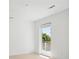 Bedroom with door leading to balcony overlooking exterior greenery at 775 Juniper Ne St # 334, Atlanta, GA 30308
