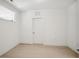 Minimalist bedroom with white walls and light hardwood flooring at 775 Juniper Ne St # 334, Atlanta, GA 30308