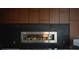 Stylish linear fireplace with sleek metal and dark wood paneling at 775 Juniper Ne St # 334, Atlanta, GA 30308
