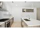 Well-lit kitchen with stainless steel appliances and white countertops at 775 Juniper Ne St # 334, Atlanta, GA 30308