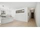 Bright, minimalist living room with open access to modern kitchen area at 775 Juniper Ne St # 334, Atlanta, GA 30308