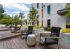 Relaxing outdoor deck with comfortable rocking chairs, lush landscaping, and serene ambiance at 775 Juniper Ne St # 334, Atlanta, GA 30308