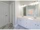 Elegant bathroom showcasing double vanity, marble floors, and large mirror at 1480 Holly Brook Rd, Snellville, GA 30078