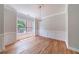 Bright dining room showcasing hardwood floors, decorative chandelier, and wainscoting at 1480 Holly Brook Rd, Snellville, GA 30078