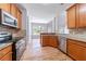 Spacious kitchen with wood cabinets, stainless steel appliances, and granite countertops at 1480 Holly Brook Rd, Snellville, GA 30078