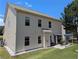Two story home featuring a patio with a small backyard and well-maintained lawn, perfect for outdoor relaxation at 1777 Weatherbrook Cir, Lawrenceville, GA 30043