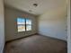 Bedroom features a window with a view of the neighborhood at 1777 Weatherbrook Cir, Lawrenceville, GA 30043