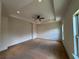 Spacious main bedroom featuring a tray ceiling with fan and recessed lighting at 1777 Weatherbrook Cir, Lawrenceville, GA 30043