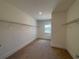 Walk-in closet with shelving and a window providing natural light at 1777 Weatherbrook Cir, Lawrenceville, GA 30043