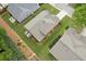 Aerial view of a well-maintained house with a large lawn and small patio area with outdoor seating at 3365 Buffington Ln, Cumming, GA 30040