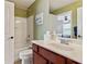 Bathroom featuring a vanity, toilet and shower-tub combination at 3365 Buffington Ln, Cumming, GA 30040