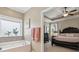 Main bathroom featuring a large bathtub and access to the main bedroom at 3365 Buffington Ln, Cumming, GA 30040