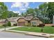 Beautiful home showcasing a well-manicured lawn and landscaping in a sidewalk community at 3365 Buffington Ln, Cumming, GA 30040