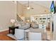 Bright living room with hardwood floors, fireplace, and vaulted ceilings at 3365 Buffington Ln, Cumming, GA 30040