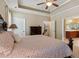 Comfortable main bedroom features dark wood furniture, tray ceiling and ensuite access at 3365 Buffington Ln, Cumming, GA 30040