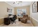 Comfortable office space with a large window, a computer setup, and a cozy recliner chair at 3365 Buffington Ln, Cumming, GA 30040