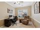 Cozy home office with a comfortable recliner, desk, and natural light at 3365 Buffington Ln, Cumming, GA 30040