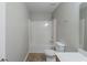 Bathroom featuring neutral tile floors, shower/tub combo, and double sink vanity at 3399 Lake Frg, Fairburn, GA 30213