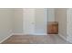 Bright bedroom with neutral carpet, light gray walls, and built in cabinets at 3399 Lake Frg, Fairburn, GA 30213