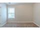 Bedroom with a large window providing natural light, neutral carpet and paint at 3399 Lake Frg, Fairburn, GA 30213