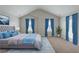 Bedroom decorated with blue curtains and bedding, creating a peaceful and stylish sanctuary at 3399 Lake Frg, Fairburn, GA 30213