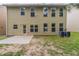 The exterior of the home features an outdoor concrete patio and several windows overlooking the backyard at 3399 Lake Frg, Fairburn, GA 30213