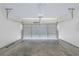 Spacious two-car garage with concrete floors and mechanical door at 3399 Lake Frg, Fairburn, GA 30213