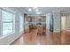 Kitchen with wooden cabinets, stainless steel appliances, an island, and hardwood floors at 3399 Lake Frg, Fairburn, GA 30213