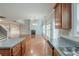 Open concept kitchen view into a living room with fireplace and soaring ceilings at 3399 Lake Frg, Fairburn, GA 30213