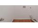 View of an empty laundry room with hardwood floors and washer/dryer hookups at 3399 Lake Frg, Fairburn, GA 30213