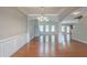 Inviting open-concept room with hardwood floors, coffered ceilings, and bright natural light at 3399 Lake Frg, Fairburn, GA 30213
