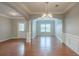 Spacious living room with hardwood floors, designer paint and archways offering architectural interest at 3399 Lake Frg, Fairburn, GA 30213
