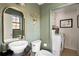 Stylish bathroom with modern vanity, vessel sink, and a convenient laundry area at 4568 Oswood Ct, Tucker, GA 30084